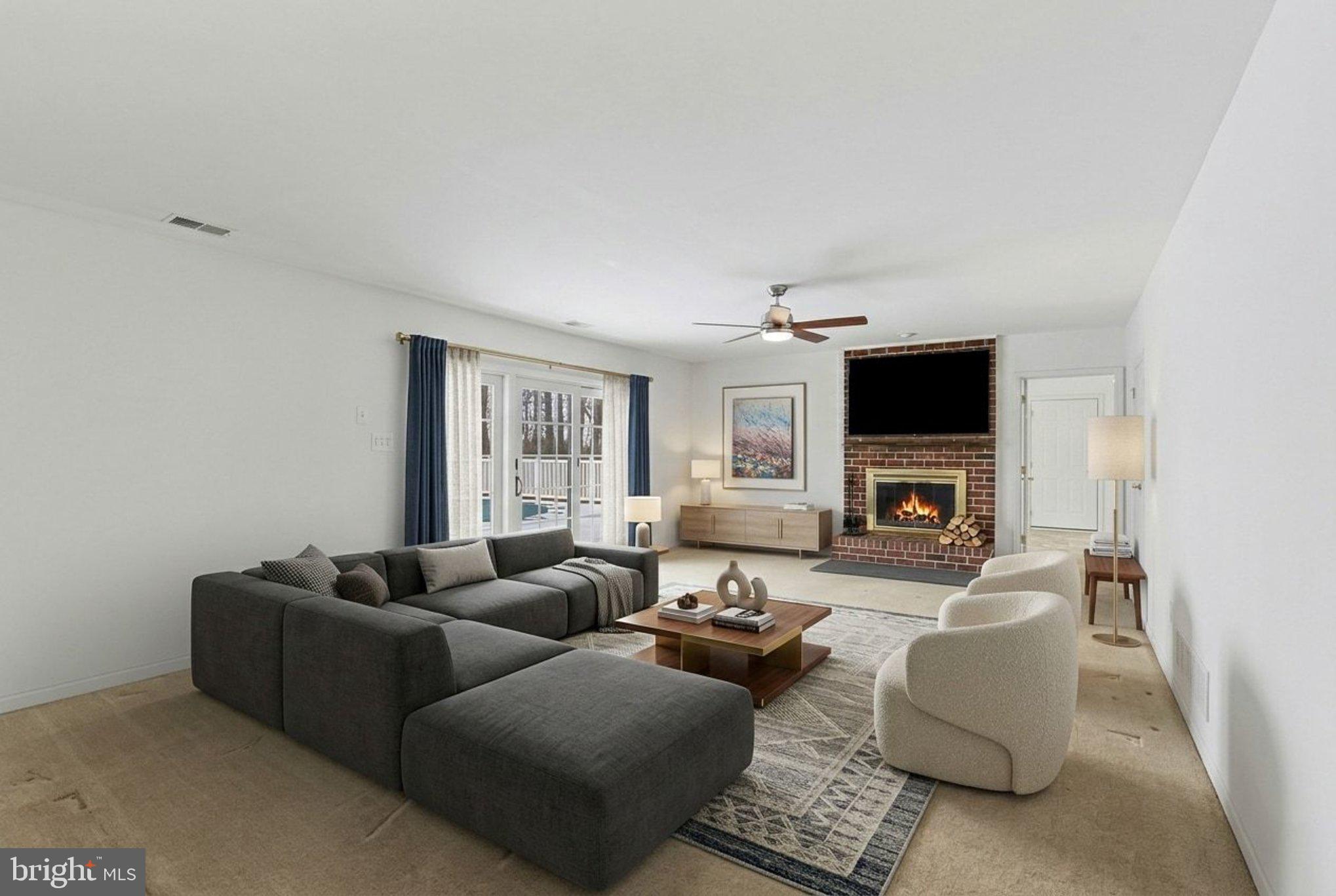 1645 Timber Summit Drive Westminster, MD 21157 - Photo 31 of 65 a living room with furniture and a fireplace