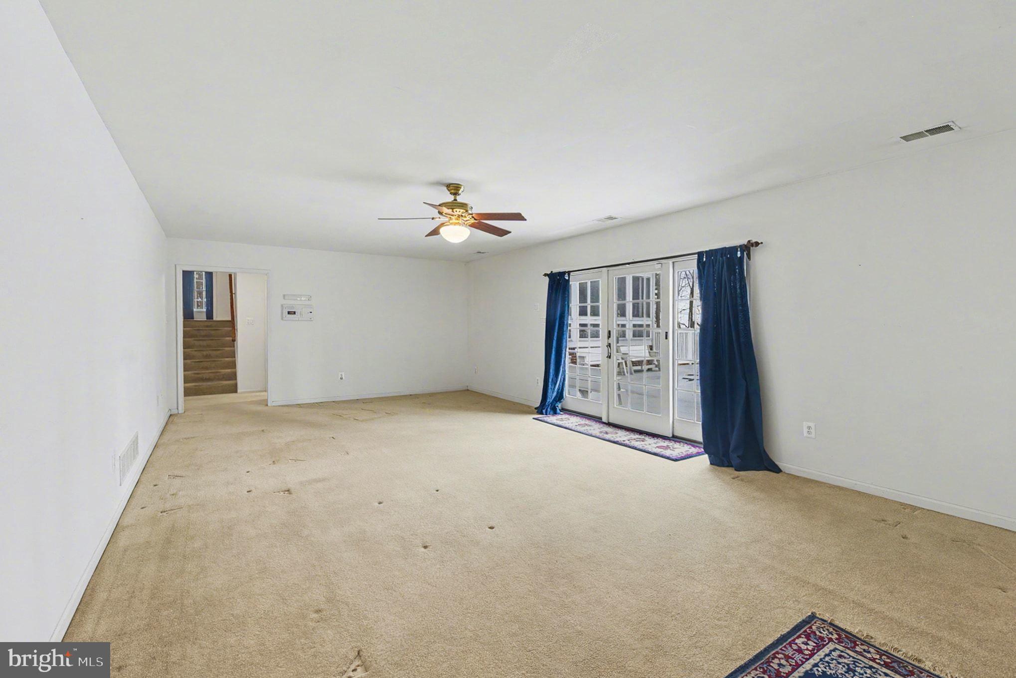 1645 Timber Summit Drive Westminster, MD 21157 - Photo 33 of 65 a view of an empty room with chandelier fan