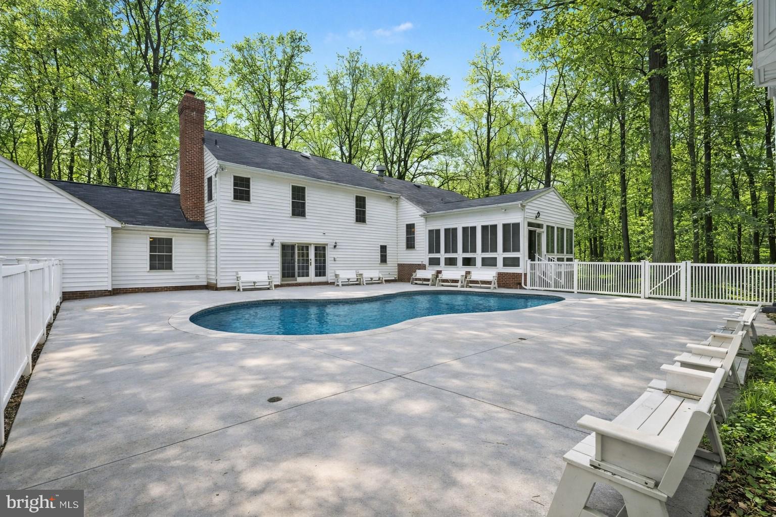 1645 Timber Summit Drive Westminster, MD 21157 - Photo 47 of 65 a view of house with swimming pool and trees in the background