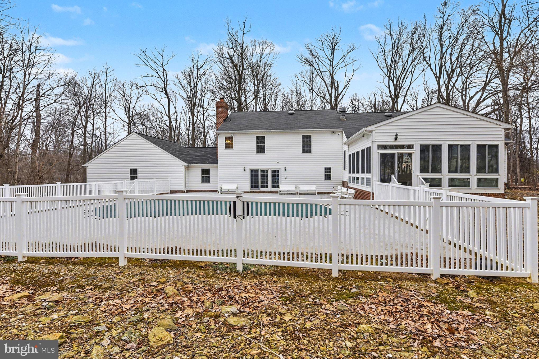 1645 Timber Summit Drive Westminster, MD 21157 - Photo 48 of 65 a front view of a house with a fence