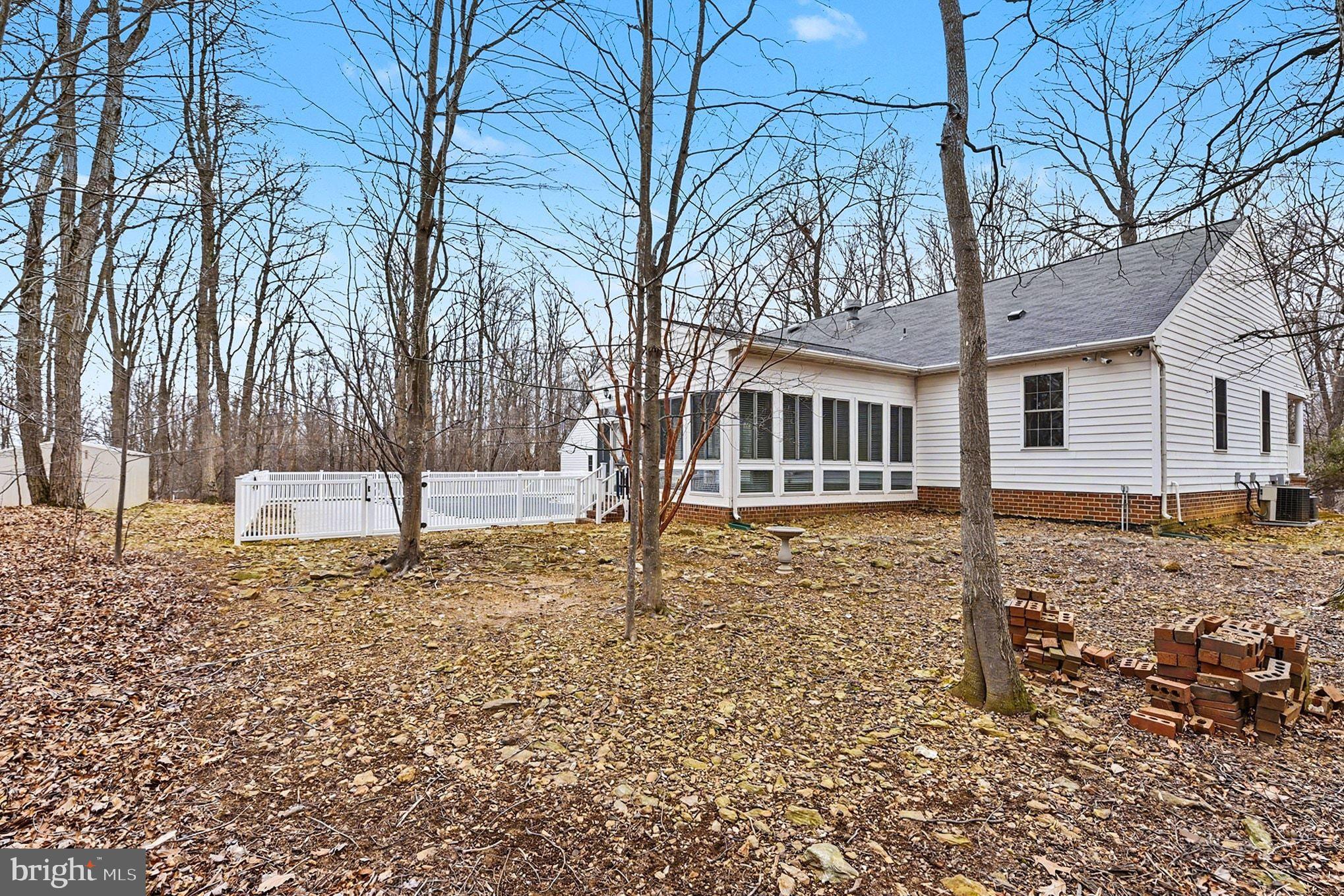 1645 Timber Summit Drive Westminster, MD 21157 - Photo 50 of 65 a house with trees in front of it