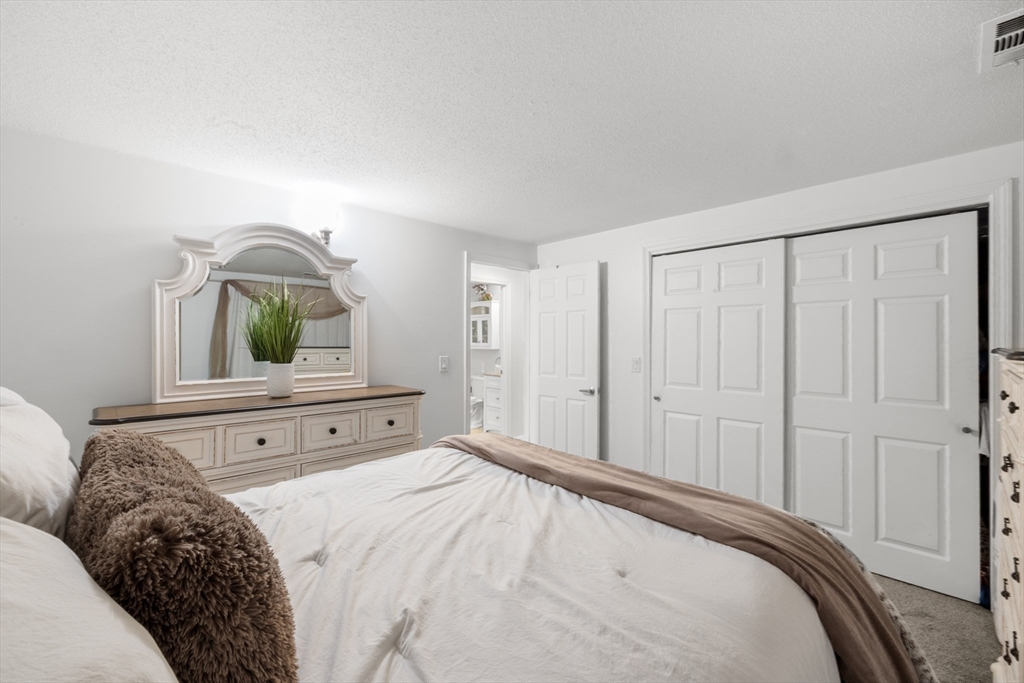 1619 Braley Road, Unit 97 New Bedford, MA 02745 - Photo 17 of 27 a bedroom with a bed and a window