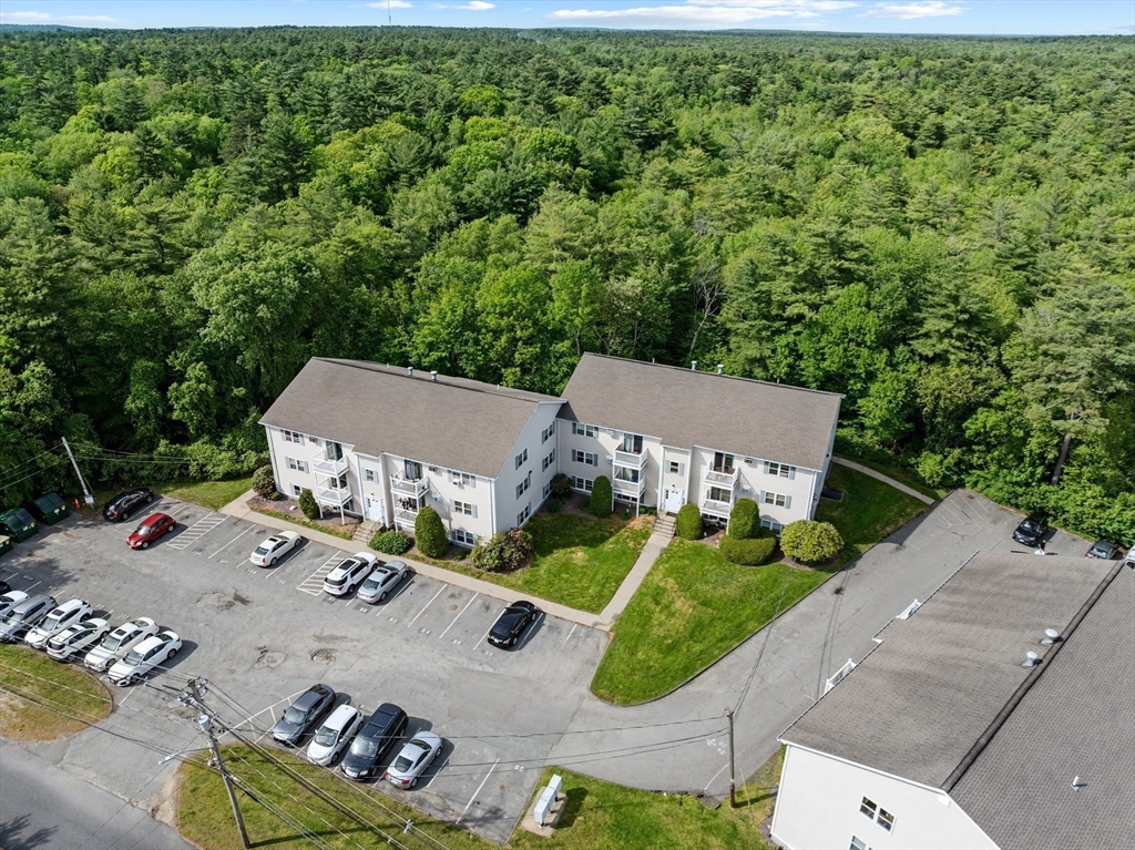 1619 Braley Road, Unit 97 New Bedford, MA 02745 - Photo 2 of 27 an aerial view of a house with backyard