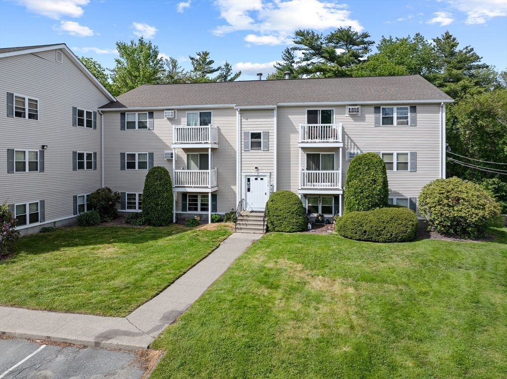 1619 Braley Road, Unit 97 New Bedford, MA 02745 - Photo 23 of 27 front view of a house with a yard