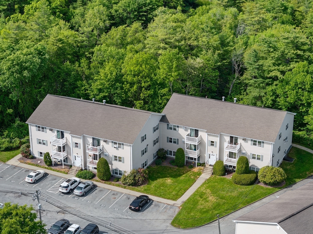 1619 Braley Road, Unit 97 New Bedford, MA 02745 - Photo 24 of 27 an aerial view of a house with swimming pool and garden