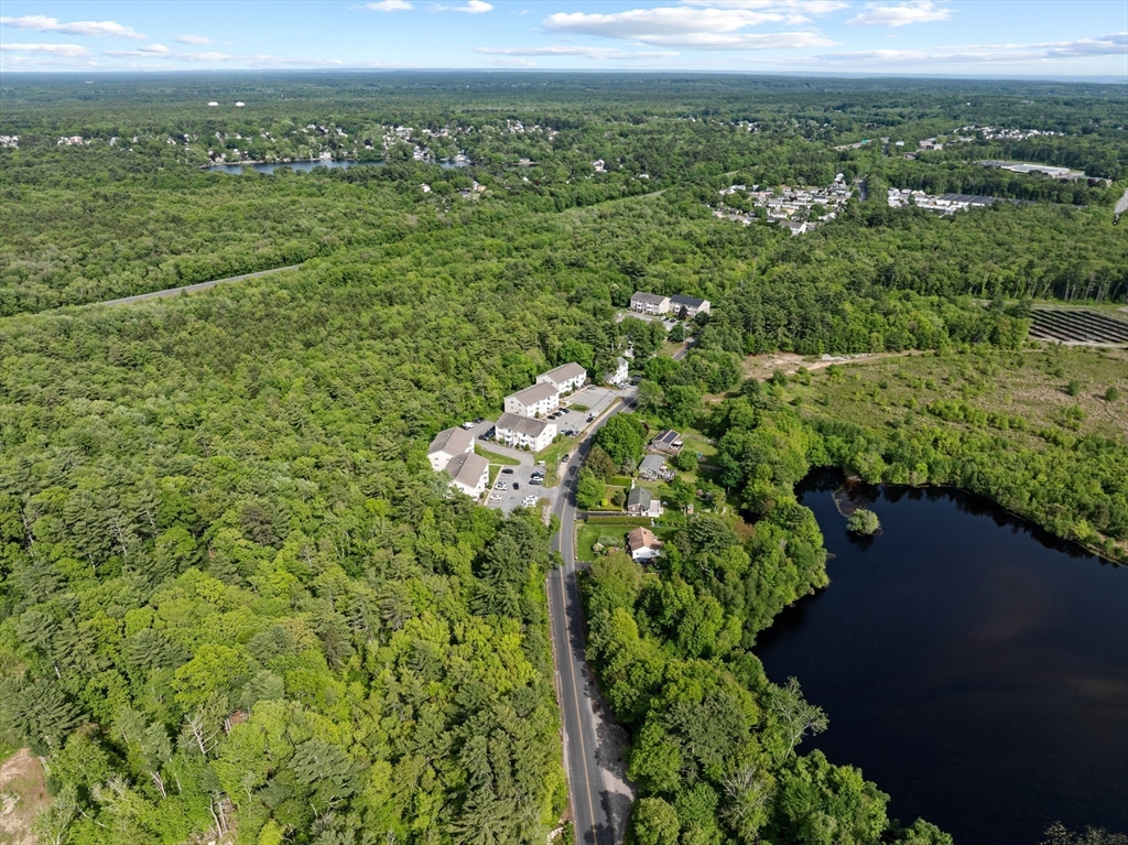 1619 Braley Road, Unit 97 New Bedford, MA 02745 - Photo 27 of 27 a view of a city with lush green forest