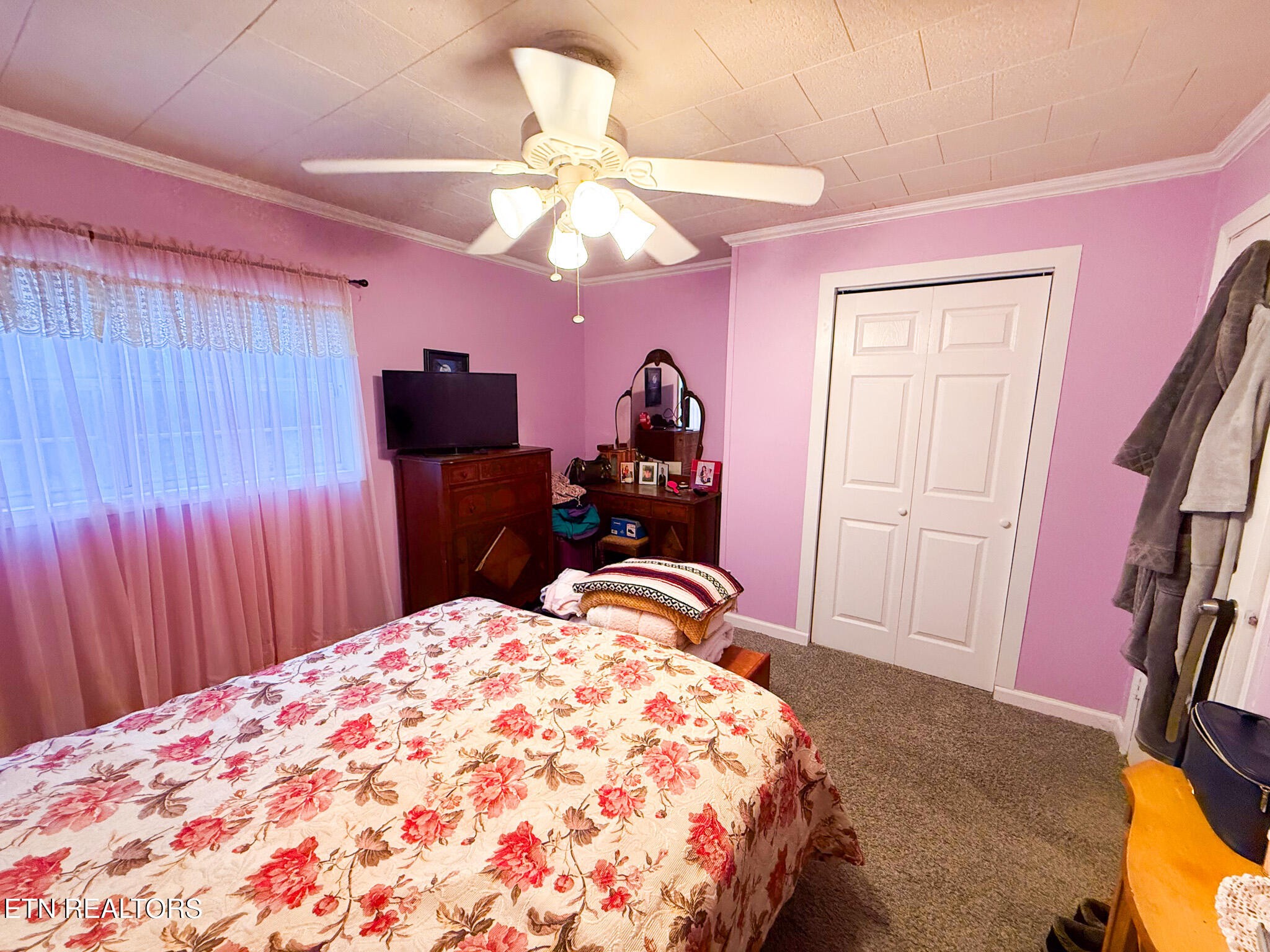 1591 Big Ridge Road Spring City, TN 37381 - Photo 12 of 30 a bedroom with a bed and a chandelier