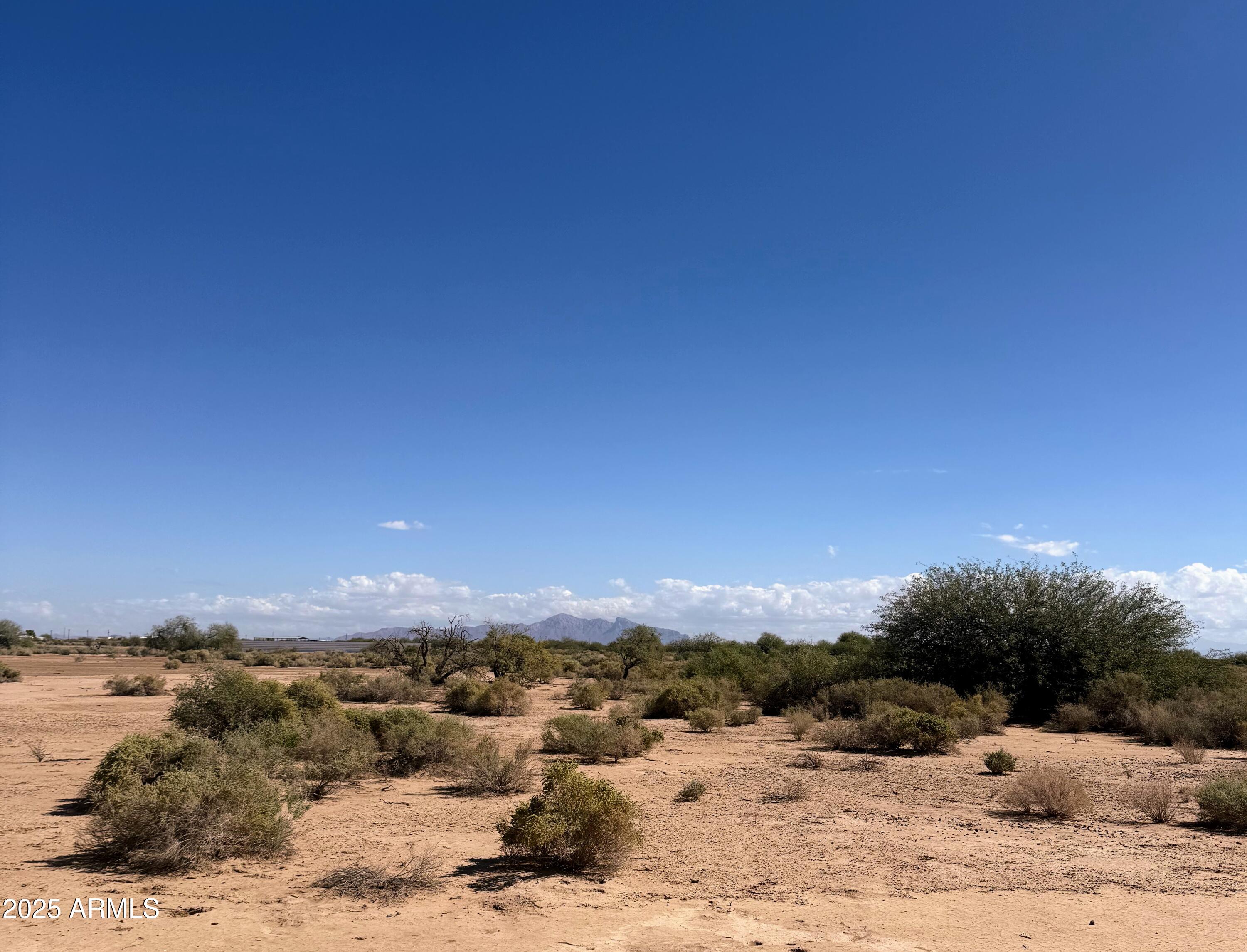 0 South Jamestown Road, Unit 12 Eloy, AZ 85131 - Photo 5 of 15 a view of a road with a building in the background