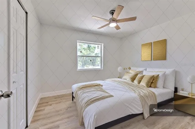 a bedroom with a bed and a painting on the wall