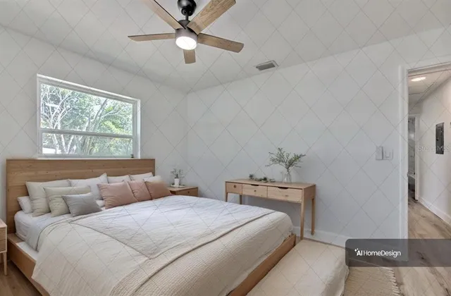 a bedroom with a large bed and a window