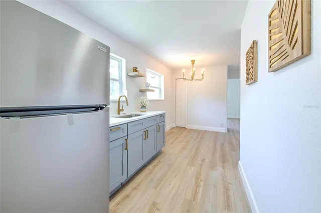 a view of a kitchen from the hallway