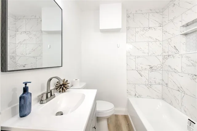 a bathroom with a sink toilet and bathtub