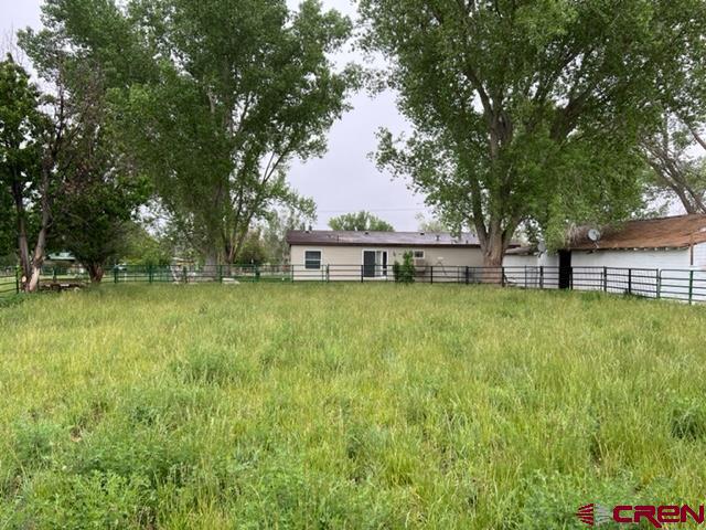 21370 H75 Road Delta, CO 81416 - Photo 23 of 26 a view of a house with a backyard