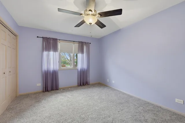 a bathroom with a double vanity sink mirror and toilet