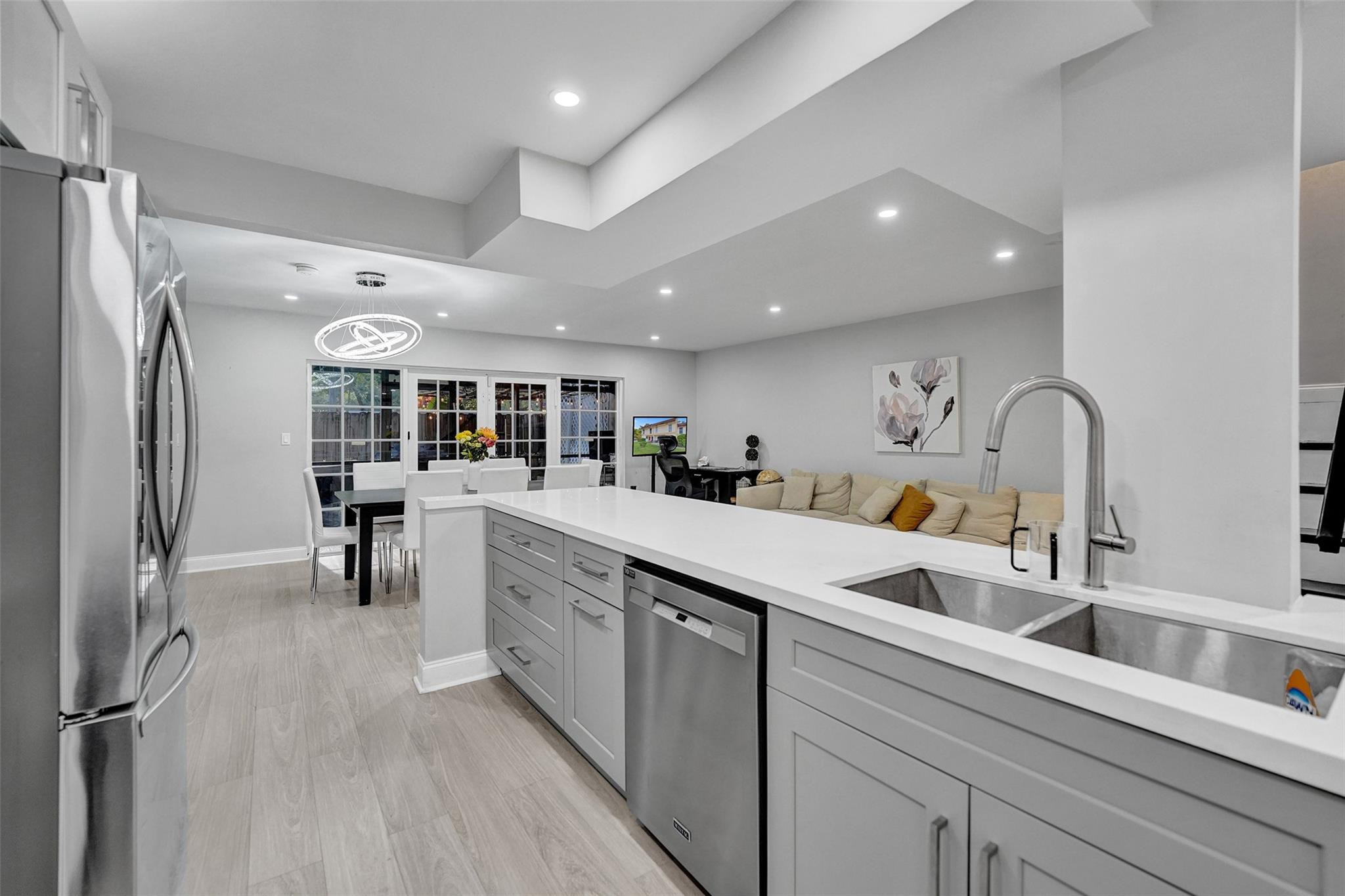 3301 Raleigh Street, Unit 4B Hollywood, FL 33021 - Photo 12 of 54 a kitchen with counter top space and stainless steel appliances