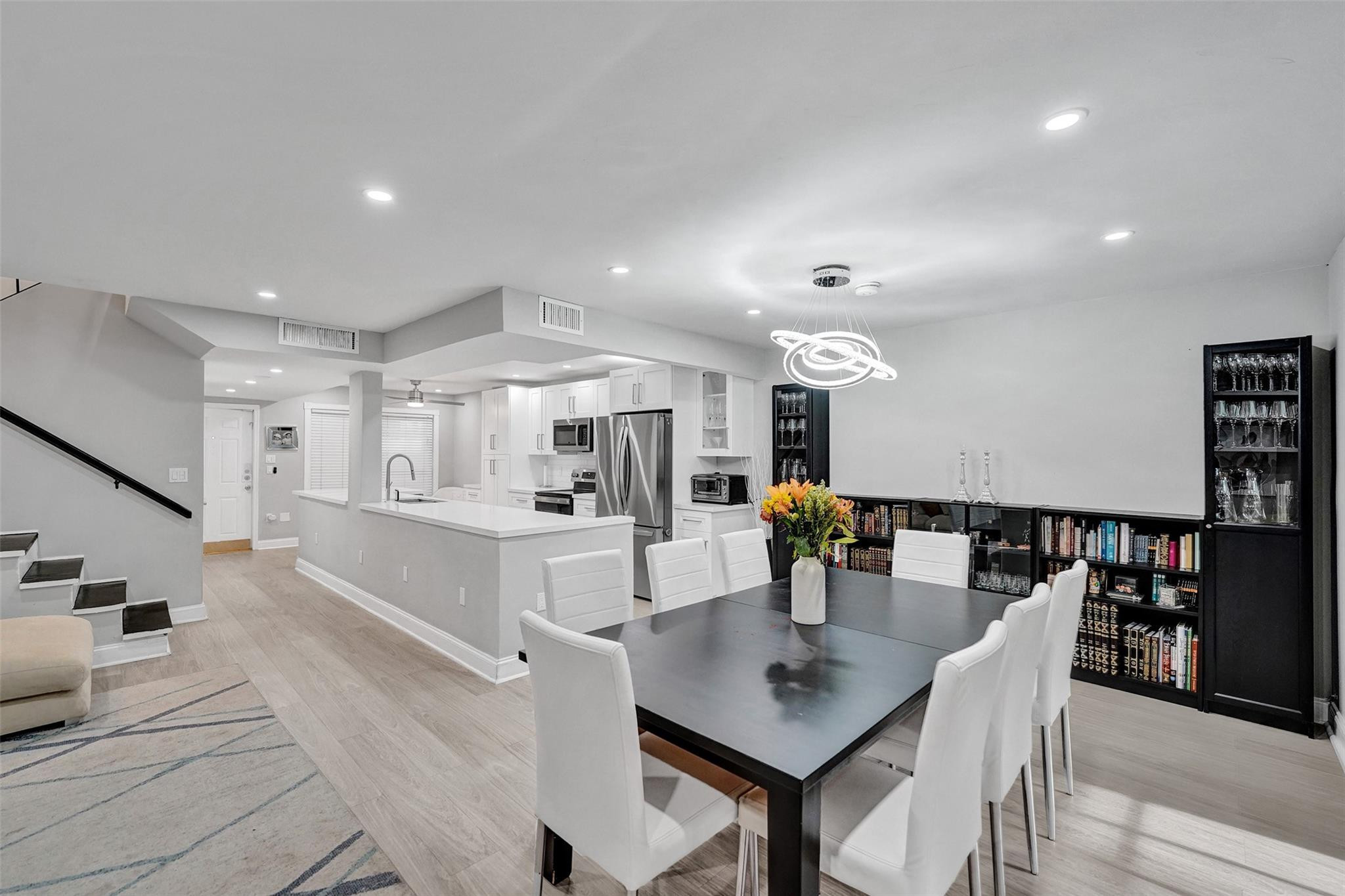 3301 Raleigh Street, Unit 4B Hollywood, FL 33021 - Photo 18 of 54 a dining room with stainless steel appliances furniture a dining table and chairs