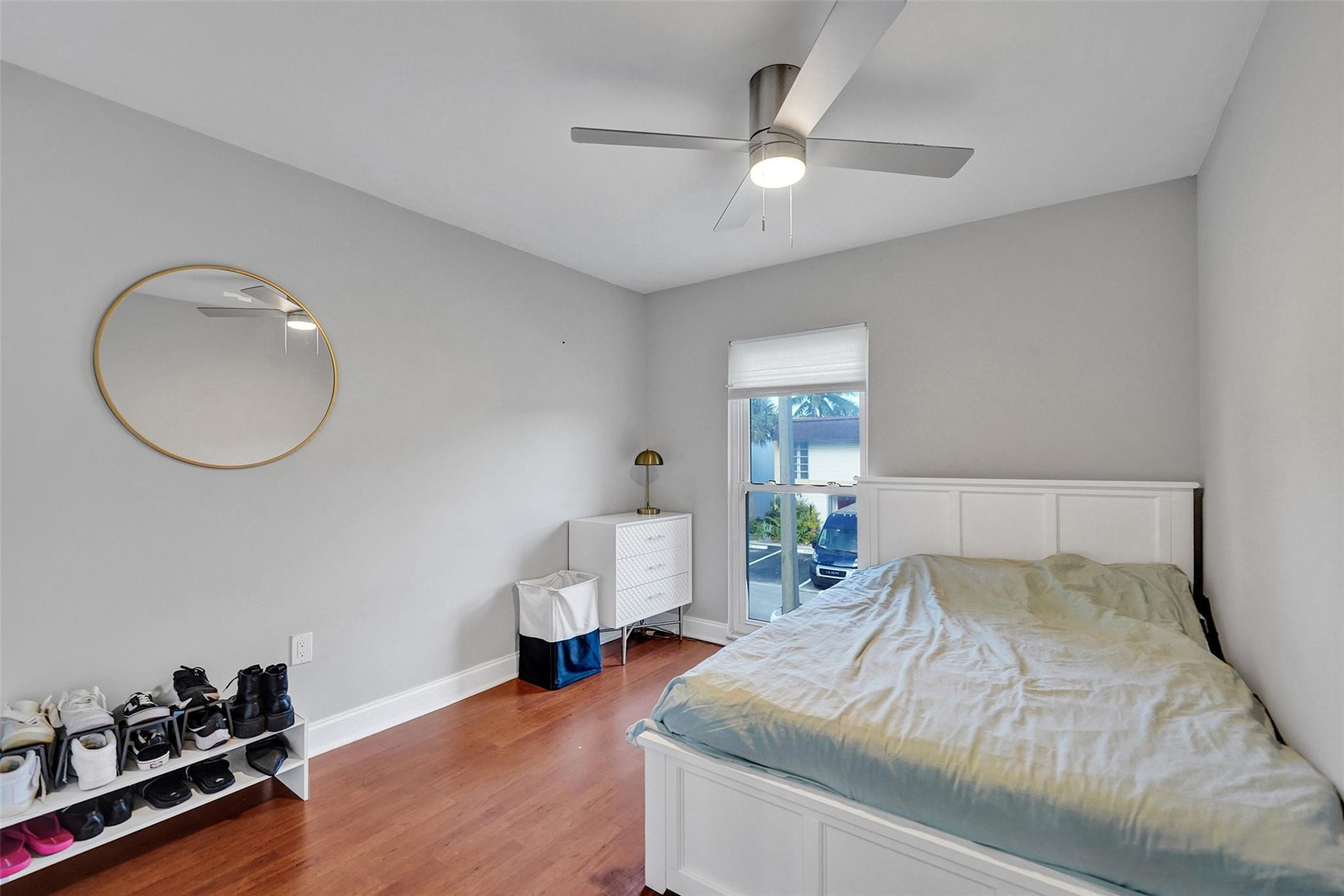 3301 Raleigh Street, Unit 4B Hollywood, FL 33021 - Photo 27 of 54 a bedroom with a bed and a chandelier