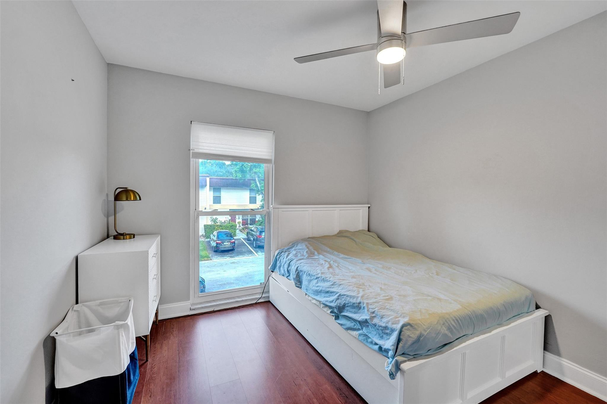 3301 Raleigh Street, Unit 4B Hollywood, FL 33021 - Photo 28 of 54 a bedroom with a bed and a window