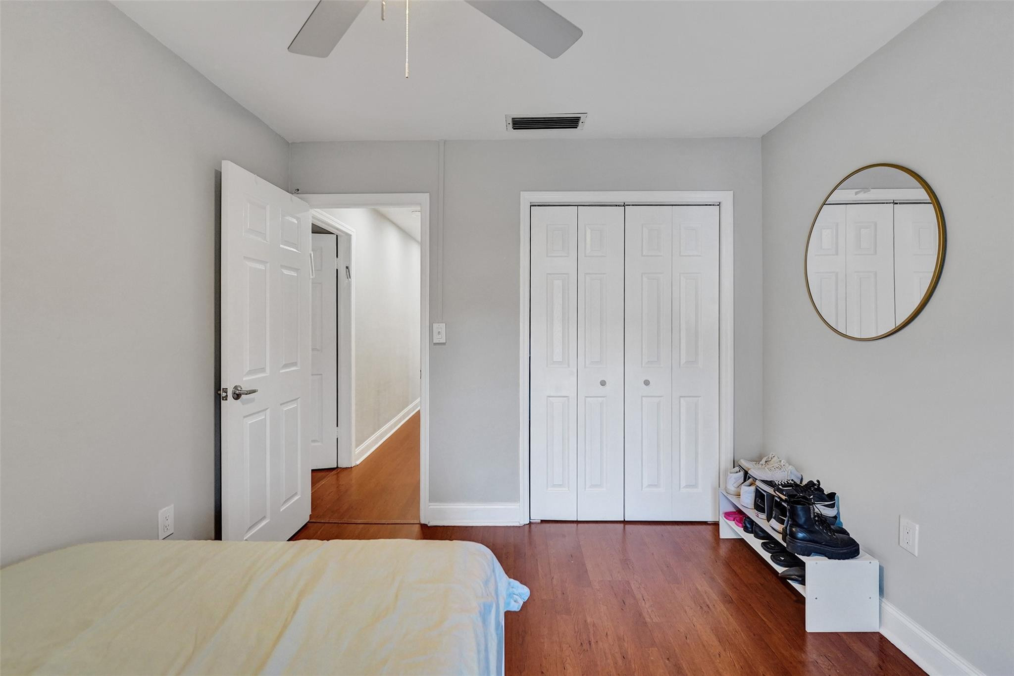 3301 Raleigh Street, Unit 4B Hollywood, FL 33021 - Photo 29 of 54 a bedroom with a bed and a mirror