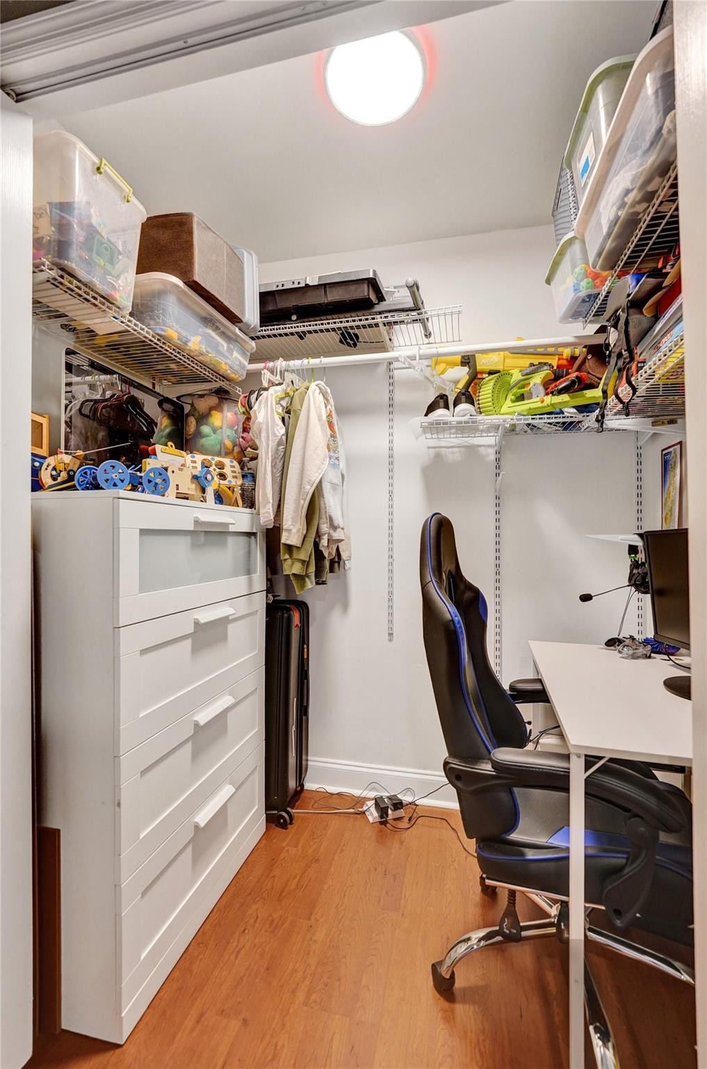 3301 Raleigh Street, Unit 4B Hollywood, FL 33021 - Photo 39 of 54 a view of walk in closet with clothes and shoes
