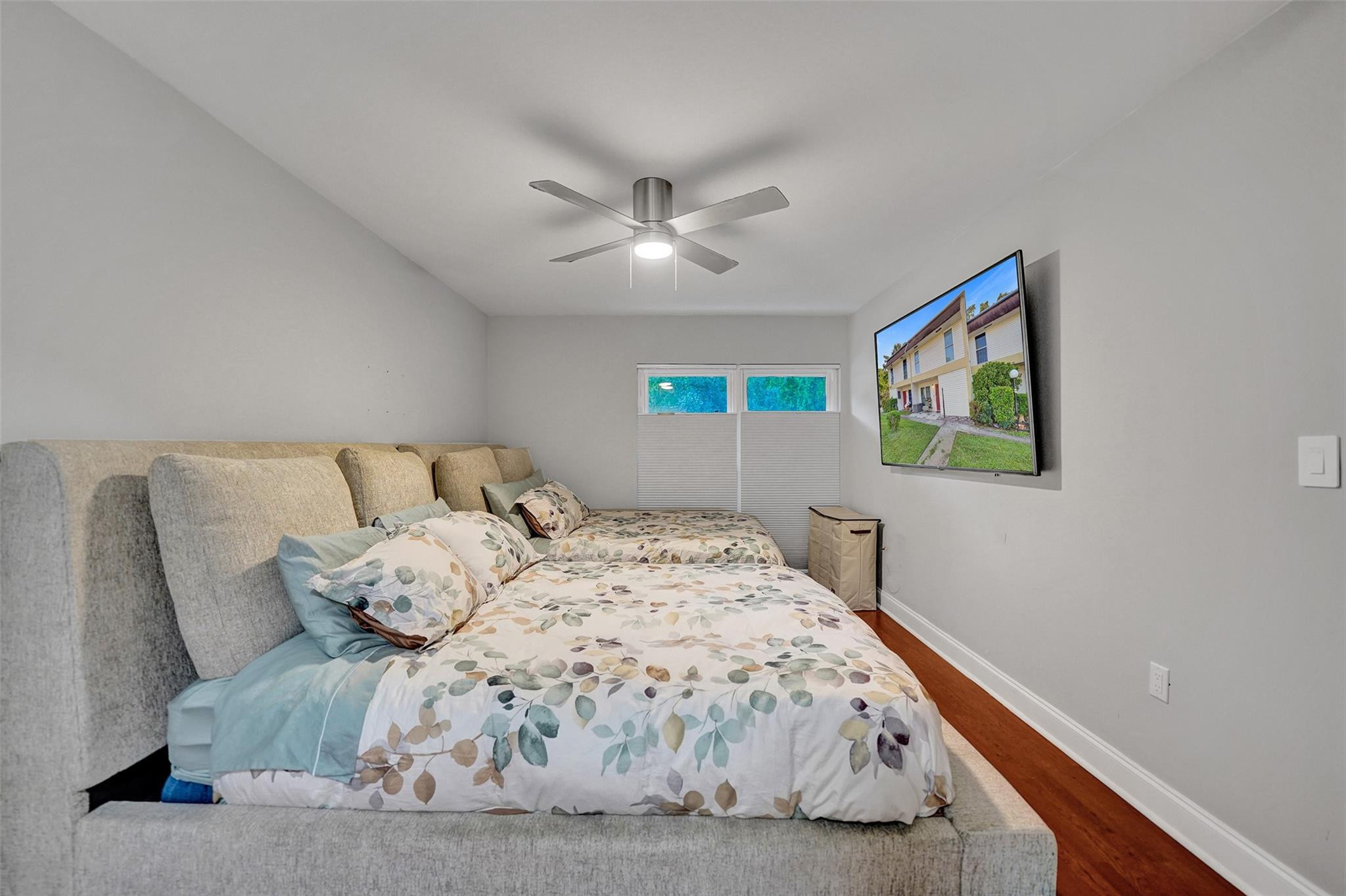 3301 Raleigh Street, Unit 4B Hollywood, FL 33021 - Photo 43 of 54 a bedroom with a bed and a painting on the wall