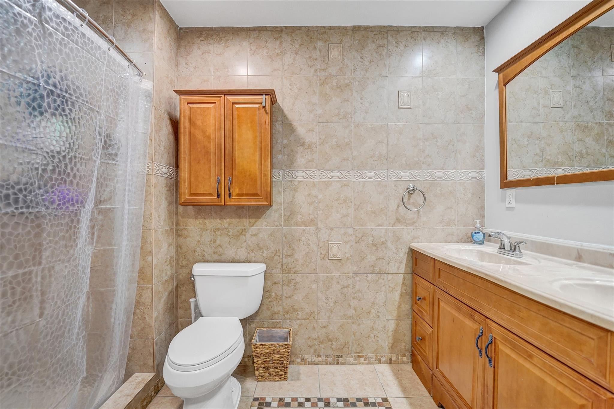 3301 Raleigh Street, Unit 4B Hollywood, FL 33021 - Photo 46 of 54 a bathroom with a granite countertop toilet sink and mirror