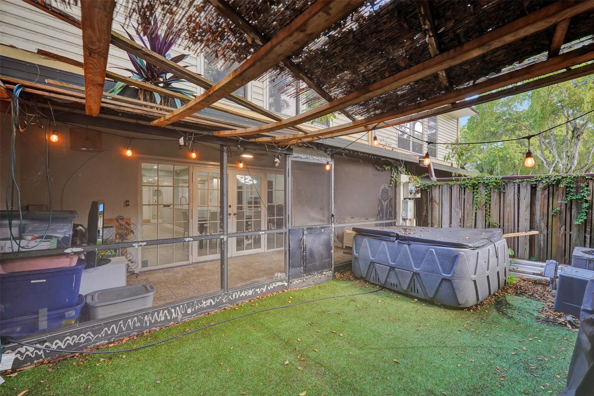 3301 Raleigh Street, Unit 4B Hollywood, FL 33021 - Photo 52 of 54 a view of a backyard with plants and wooden fence
