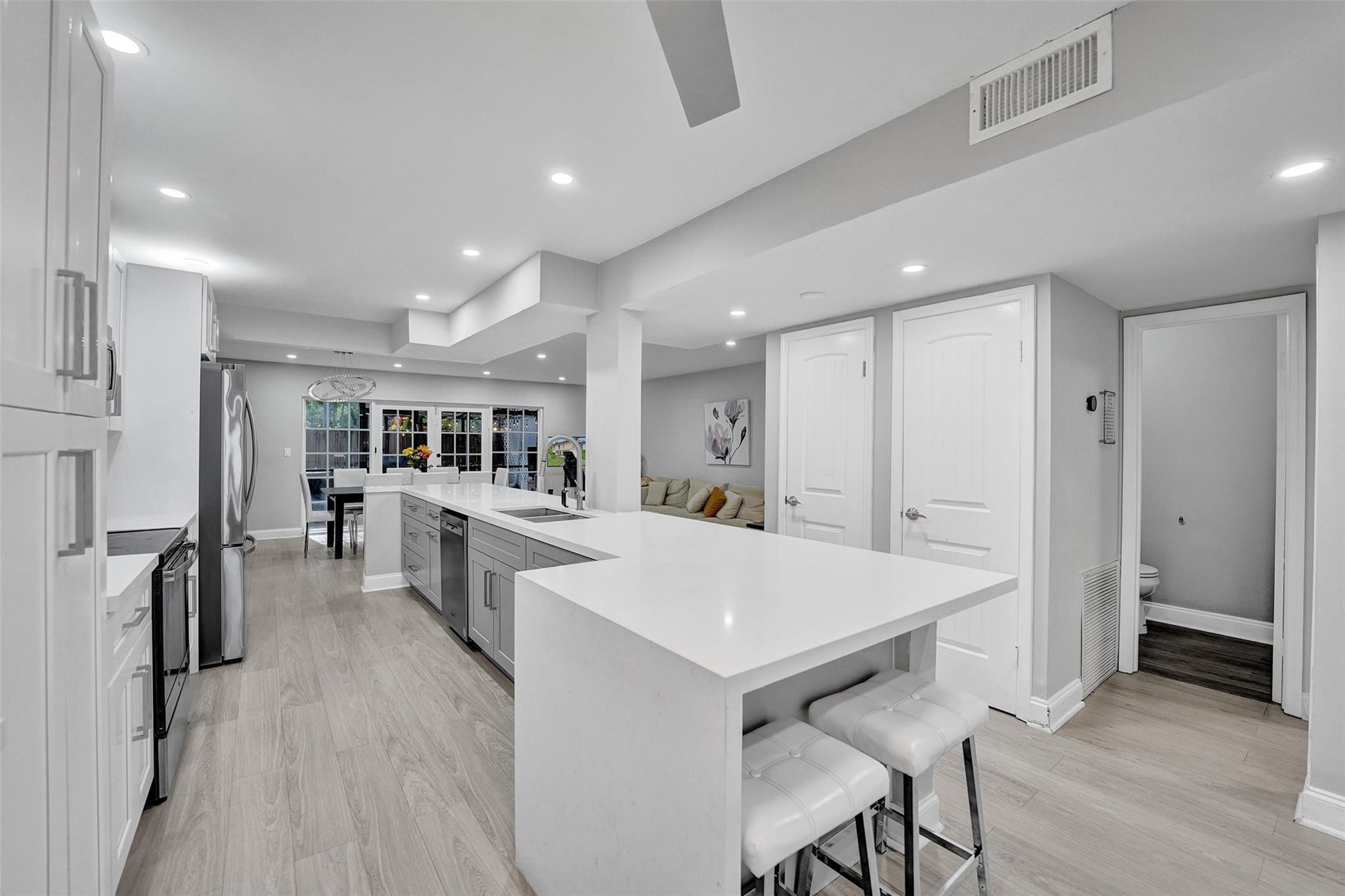 3301 Raleigh Street, Unit 4B Hollywood, FL 33021 - Photo 8 of 54 a view of kitchen with cabinets and wooden floor