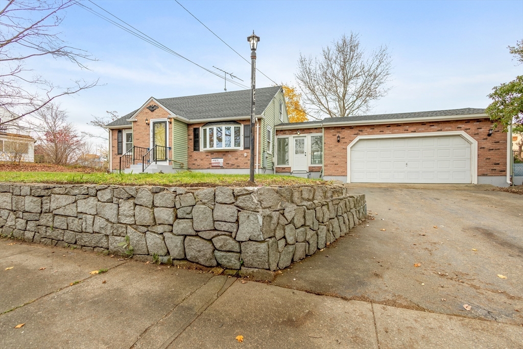 a front view of a house with a outdoor space