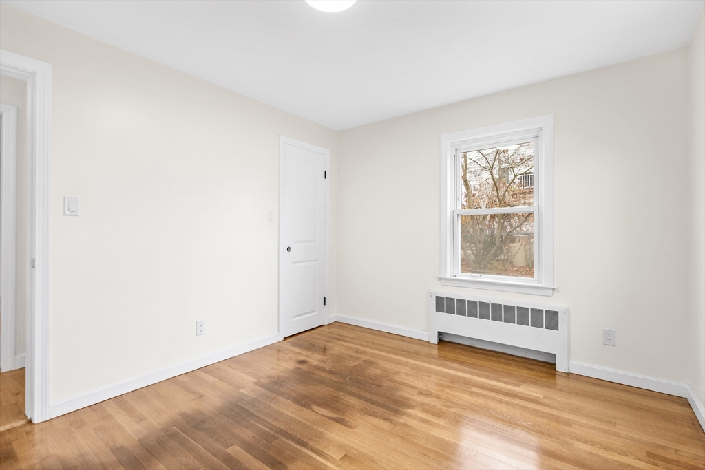 25 Lakeview Street Blackstone, MA 01504 - Photo 12 of 26 a view of an empty room with wooden floor and a window