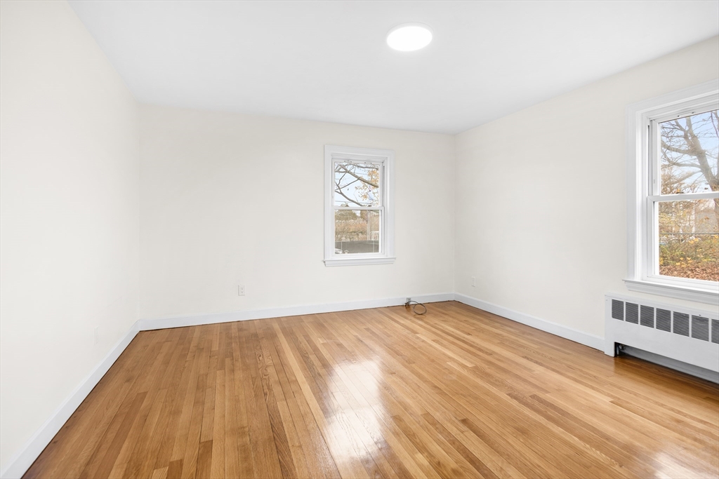 25 Lakeview Street Blackstone, MA 01504 - Photo 13 of 26 an empty room with wooden floor and windows