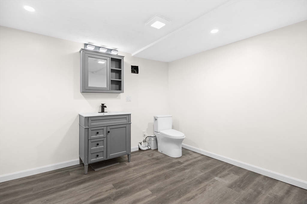 25 Lakeview Street Blackstone, MA 01504 - Photo 20 of 26 a spacious bathroom with a toilet sink and mirror