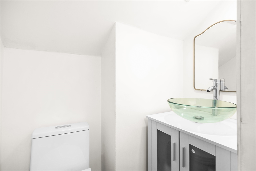 25 Lakeview Street Blackstone, MA 01504 - Photo 5 of 26 a bathroom with a sink and a mirror