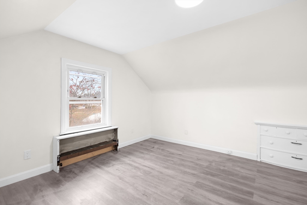 25 Lakeview Street Blackstone, MA 01504 - Photo 6 of 26 an empty room with wooden floor and window