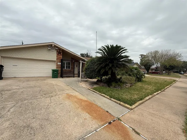 a house with palm tree in front of it