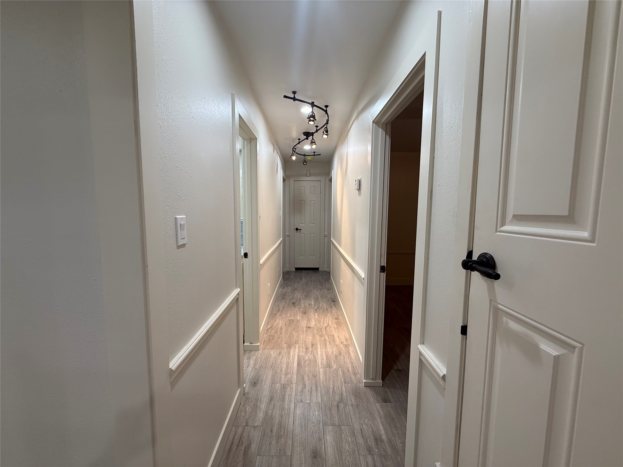 822 Hidden Valley Drive Houston, TX 77088 - Photo 23 of 48 a view of a hallway with wooden floor and staircase