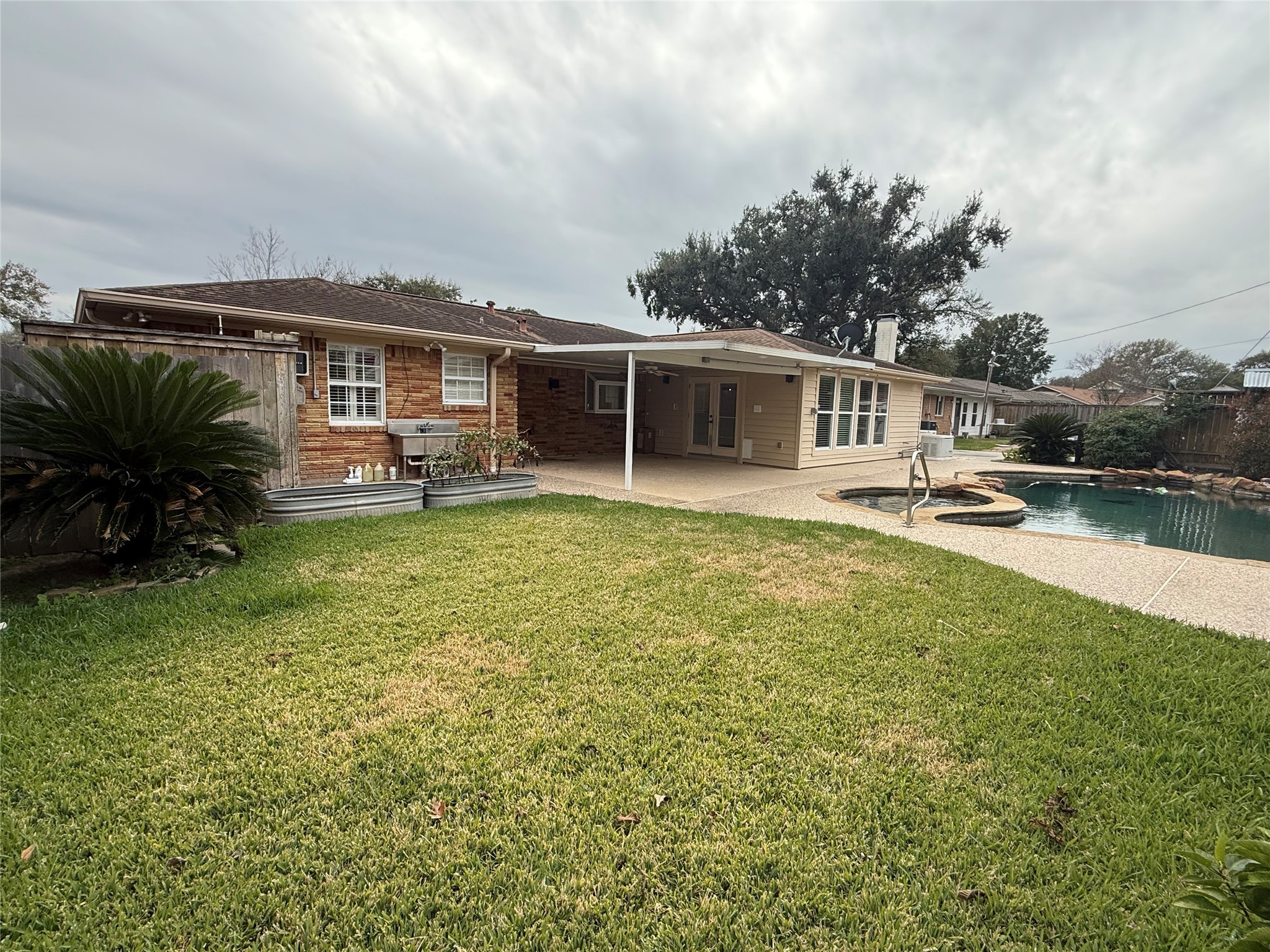 822 Hidden Valley Drive Houston, TX 77088 - Photo 41 of 48 a front view of a house with garden