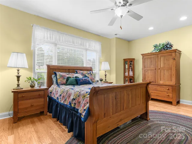 a bed room with a bed and a television