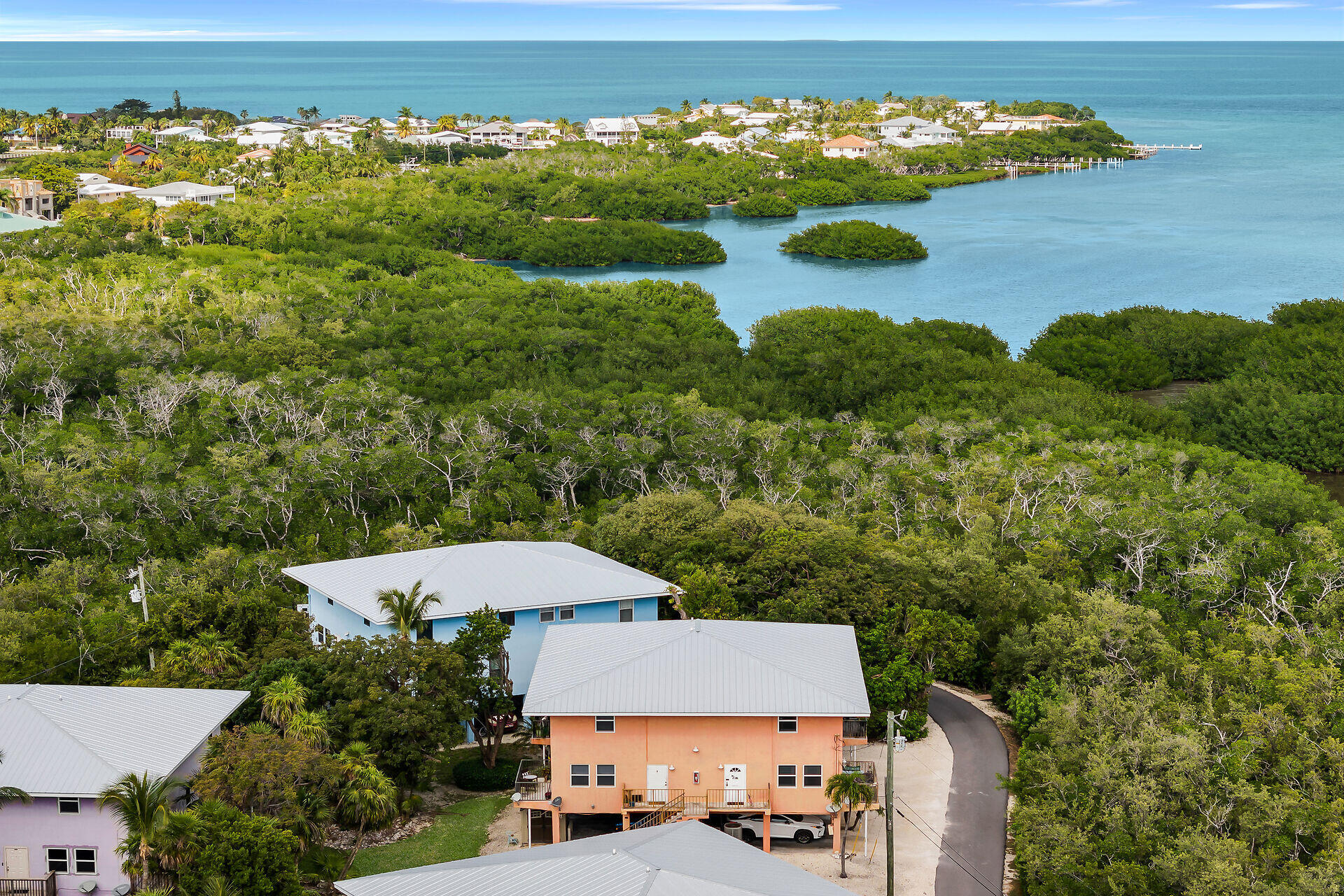111 Stirrup Key Woods Road, Unit 2B1 Marathon, FL 33050 - Photo 34 of 36 an aerial view of a house with a garden and lake view