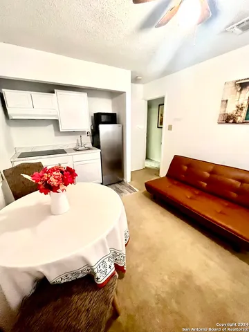 a bedroom with a bed and a potted plant