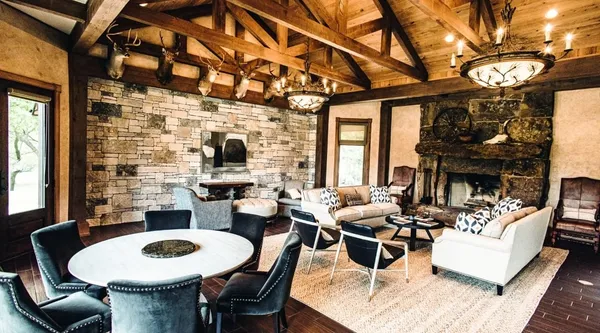 a aerial view of a house with pool and a yard