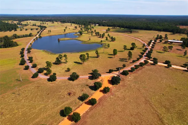 an aerial view of house with yard swimming pool and outdoor seating