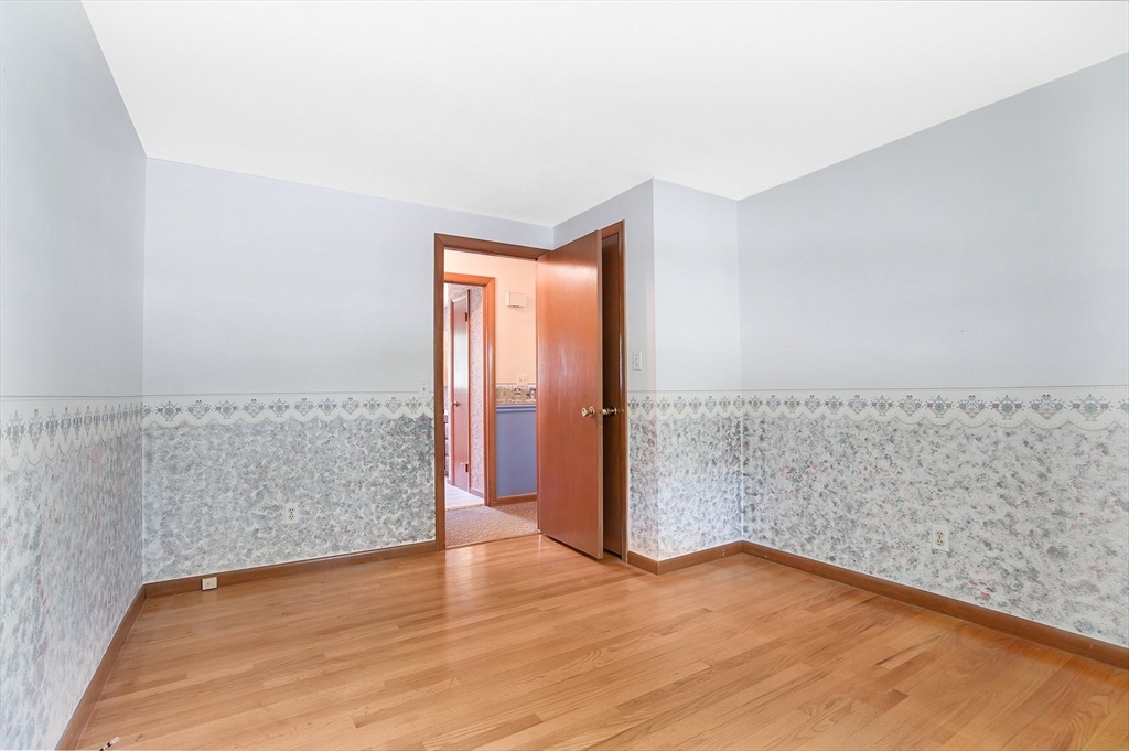 100 Penncastle Street Springfield, MA 01129 - Photo 19 of 26 a view of wooden floor and brick walls