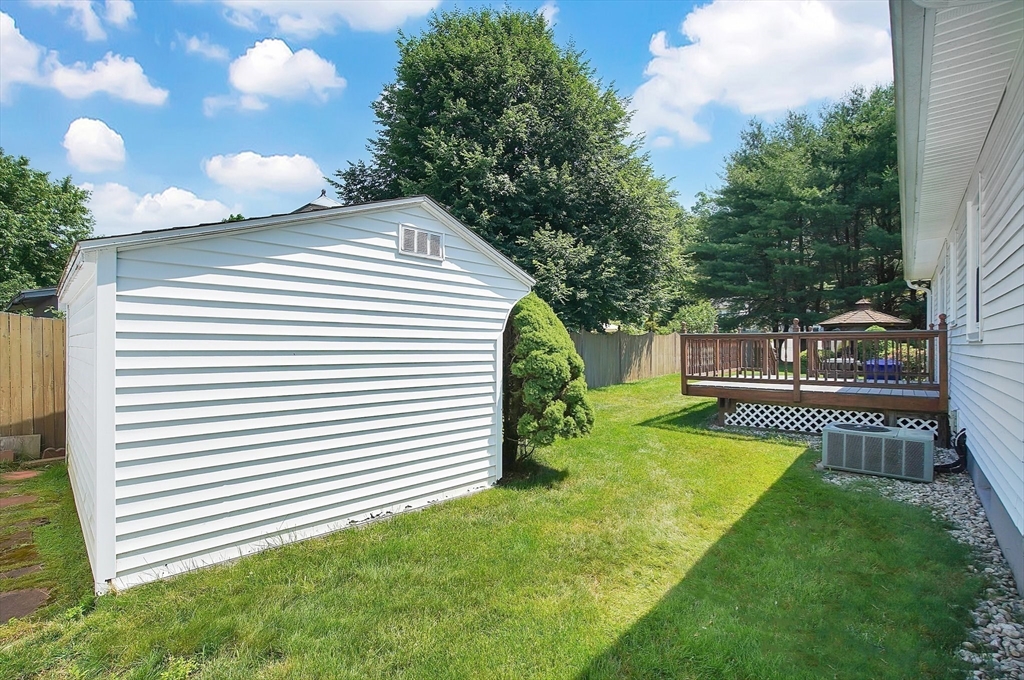 100 Penncastle Street Springfield, MA 01129 - Photo 25 of 26 a view of a backyard with sitting area and garden