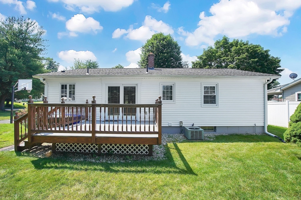 100 Penncastle Street Springfield, MA 01129 - Photo 26 of 26 a view of a house with a deck and a yard