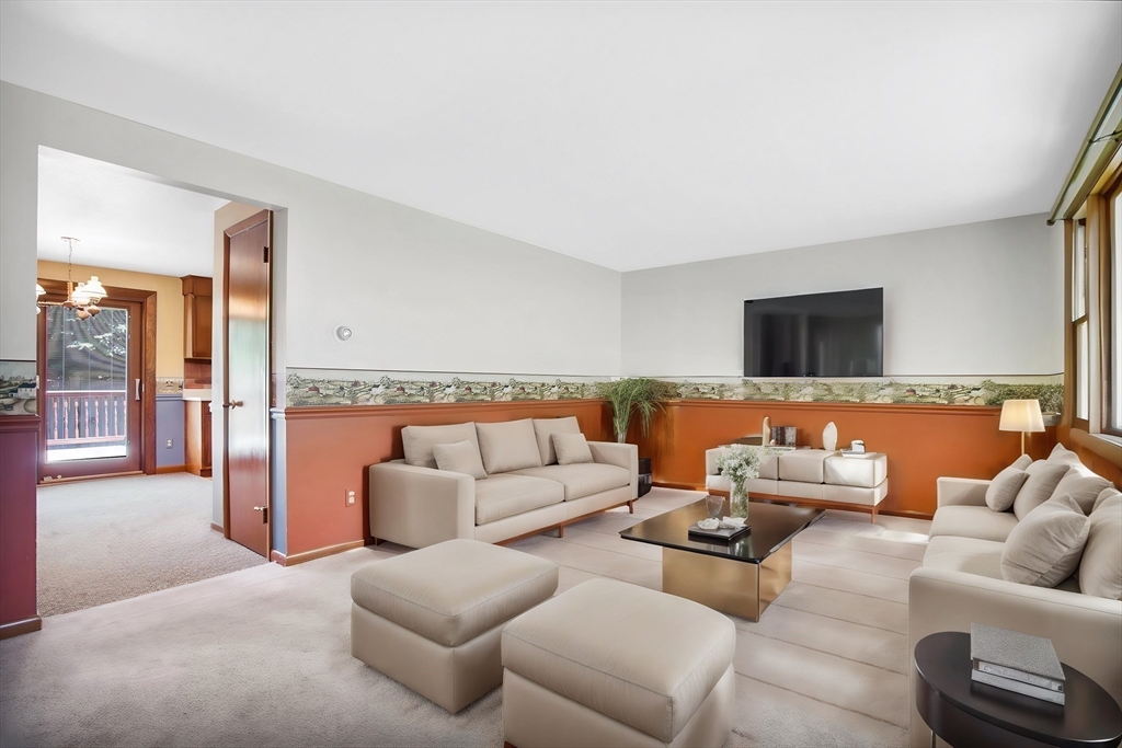 100 Penncastle Street Springfield, MA 01129 - Photo 4 of 26 a living room with furniture and a flat screen tv