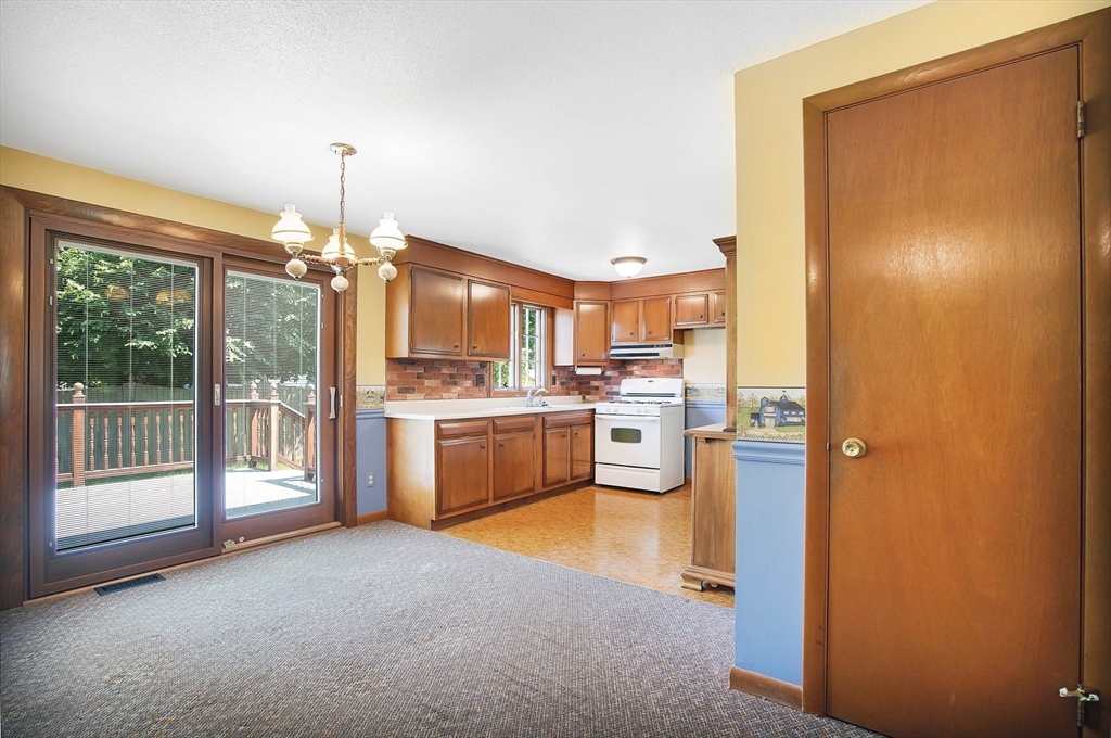 100 Penncastle Street Springfield, MA 01129 - Photo 8 of 26 a open kitchen with granite countertop a sink cabinets and stainless steel appliances