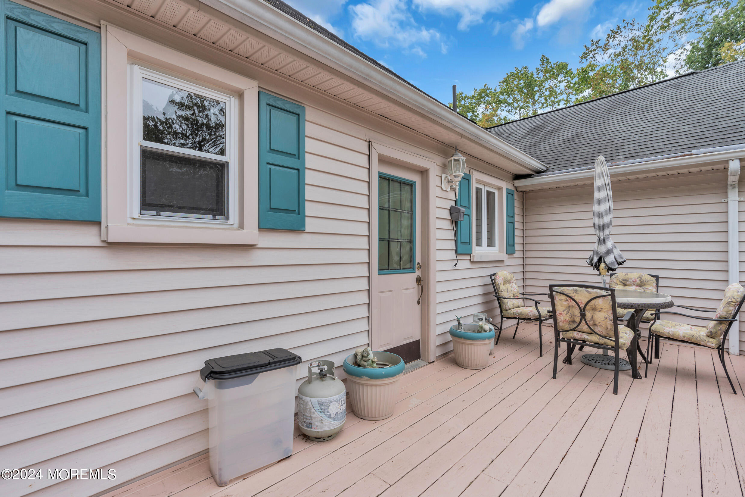 1126 Toms River Road Jackson, NJ 08527 - Photo 20 of 38 a view of a patio with couches chairs and potted plants
