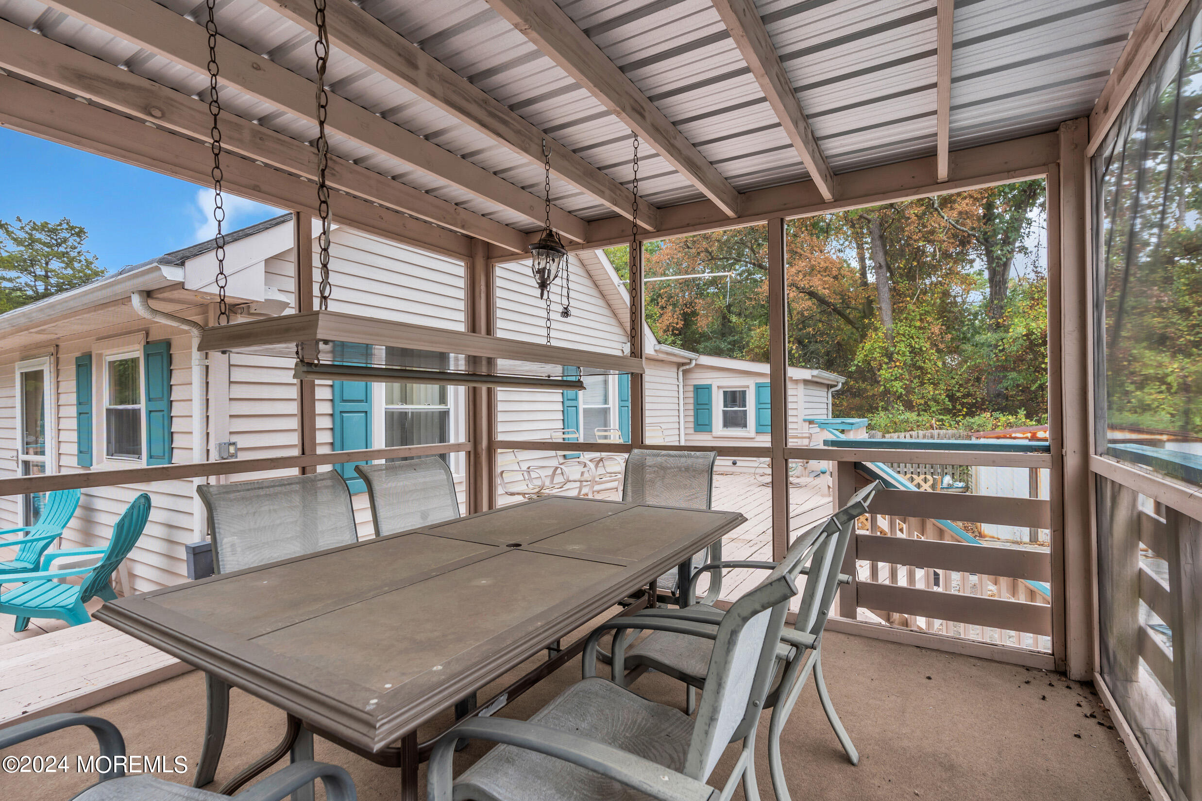 1126 Toms River Road Jackson, NJ 08527 - Photo 26 of 38 a view of a patio with table and chairs and potted plants