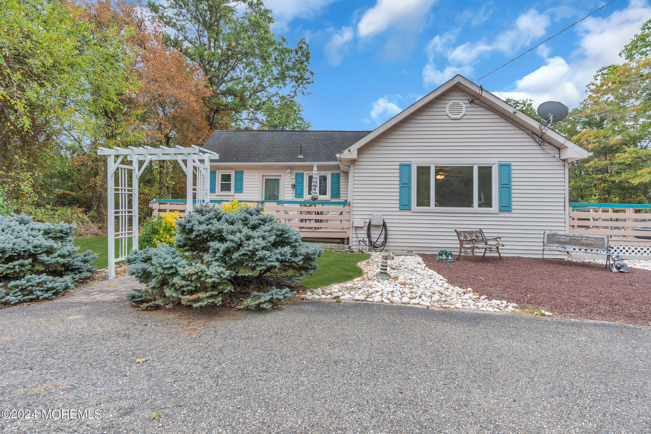 1126 Toms River Road Jackson, NJ 08527 - Photo 34 of 38 a front view of a house with a yard and garage